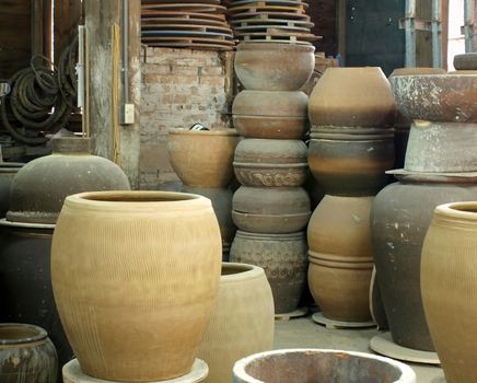 A ceramics workshop with large earthenware pots
