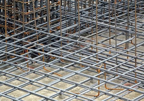 Reinfirced steel bars are being prepared for a concrete foundation
