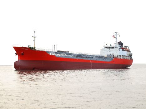 A commercial petroleum bulk transport ship against a white background
