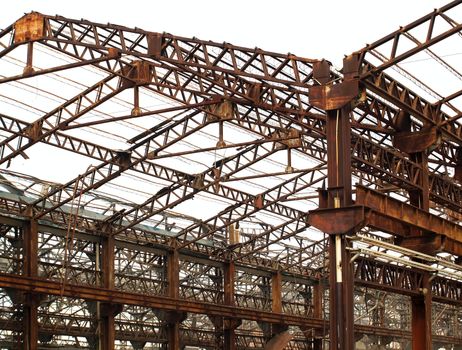 Ruins of old factory buildings that are turning into rust