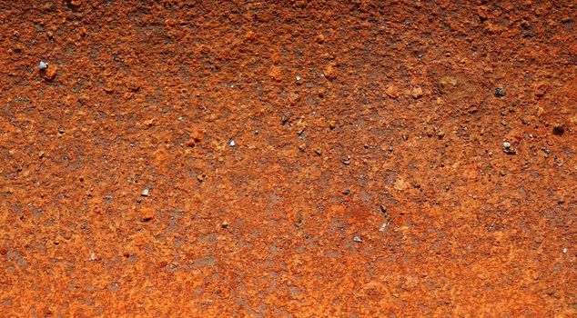 Background texture of a heavily corroded and rusted piece of scrap metal