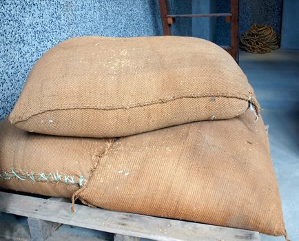 Heavy sacks with rice that is prepared to be hulled