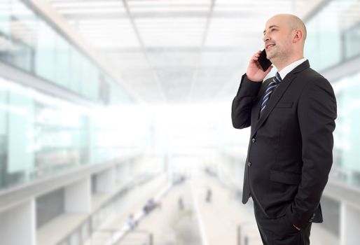 happy business man on the phone, at the office