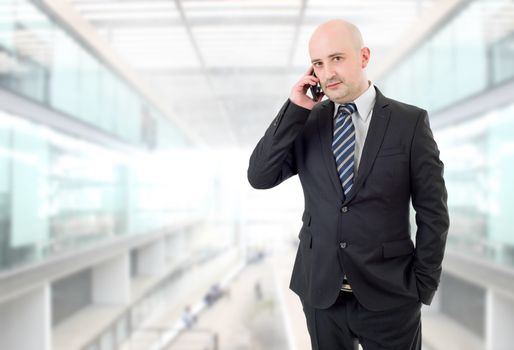 happy business man on the phone, at the office