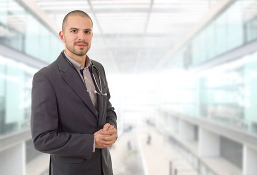 happy male doctor, at the hospital