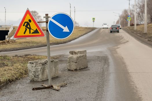 road sign, detour, road repair on asphalt road on highway