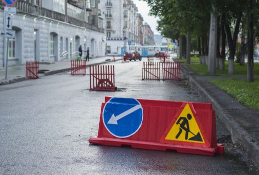 wet road sign road detour