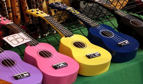Colorful ukuleles on sale at an outdoor stall