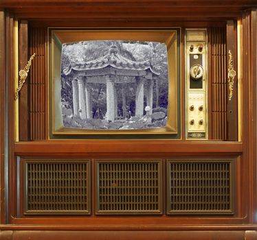 A vintage television set from about sixty years ago with a grainy pic
