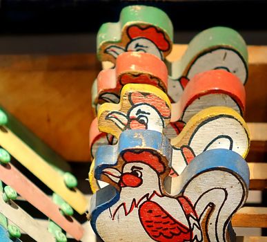 A retro era toy for young children with four wooden hens