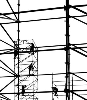 Construction workers in outline on a stage setup