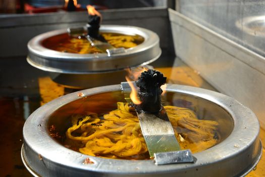 Burning candles in temple.