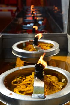 Burning candles in temple.