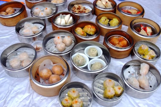 Chinese steamed dimsum in bamboo containers traditional cuisine	