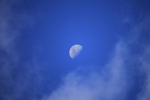 Moon clouds daytime sky.