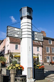 Bury St Edumnds, UK - September 19, 2011:  An historic art deco sign post in the middle of Bury St Edmunds showing the direction of a number of East Anglian places. 