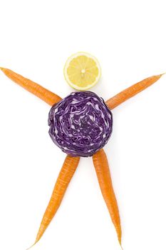 Plant nutrition and health: carrots for arms and legs, a red cabbage for the body and a slice of lemon for the head. A message for healthy people.
