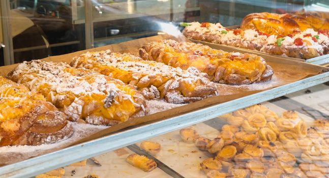 succulent Portuguese pastries displayed in the pastry cook's window in Porto