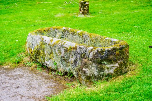 cracked stone coffin or tomb in churchyard UK