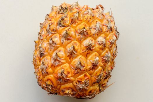 Close-up of skin of ripe pineapple. Fresh pineapple texture. Abstract nature background texture of pineapple skin. The skin is were most of the bromelain, a protein that helps in digestion and healing