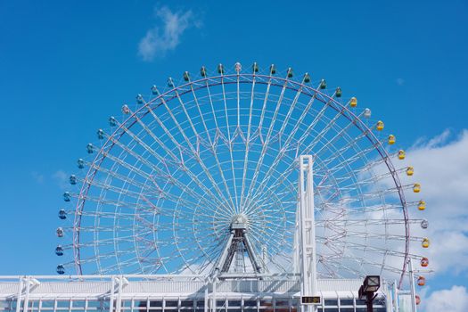 Tempozan giant ferris wheel in Osaka, Japan with  bright blue sky