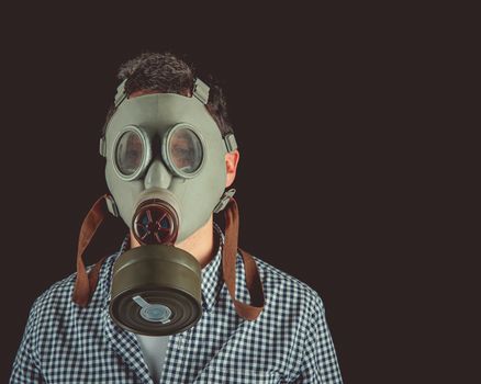 man in old military gas mask. copy space.