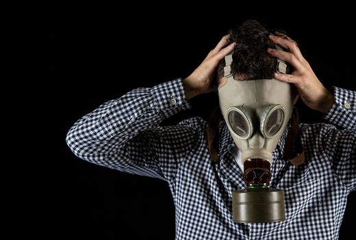 a man in a gas mask is worried about the current situation.