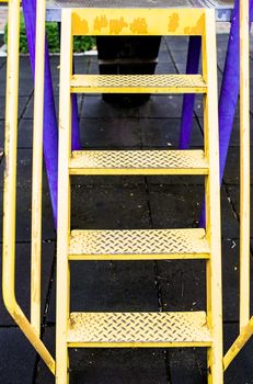 Yellow stairs for amusement in the park.