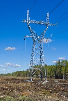 construction of new high voltage lines in forest. Estonia. new mast of a high voltage power line. installation of a high voltage power line