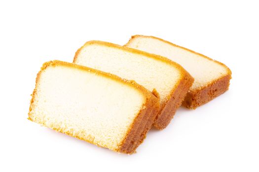 Sliced moist butter cake isolated over the white background.