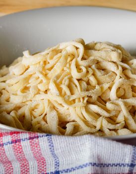 Fresh homemade italian tagliatelle pasta, also called fettuccine