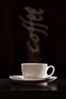 Time for a break. A cup of warm and flavored coffee with the smoke writing "coffee"