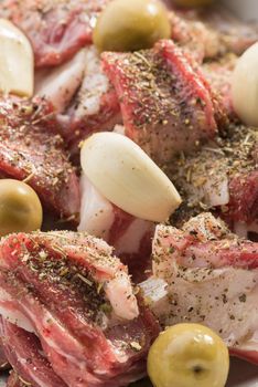 Marinade of lamb stew with herbes de Provence, garlic and olives