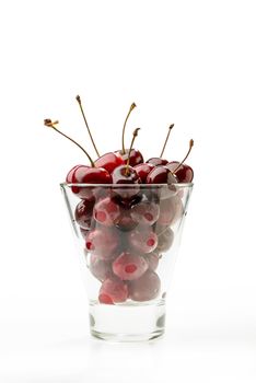 Fresh and natural red cherries in a glass