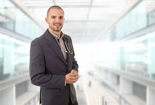 happy male doctor, at the hospital