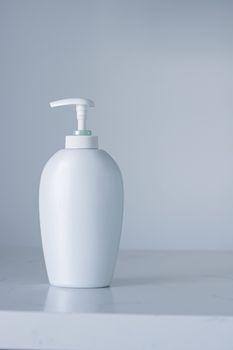 Blank label cosmetic container bottle as product mockup on gray background, hygiene and healthcare