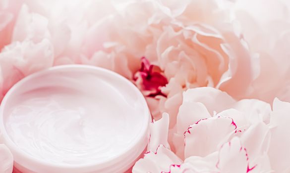 Luxe cosmetic cream jar as antiaging skincare routine product on background of peony flowers, body moisturizer and beauty branding design