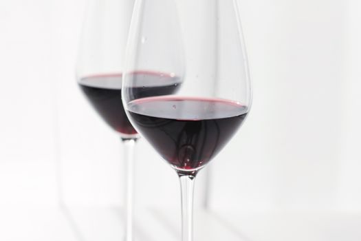 Two crystal glasses of red wine, organic beverage product