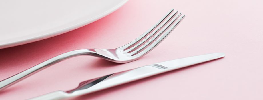 Empty plate and cutlery as mockup set on pink background, top tableware for chef table decor and menu branding design