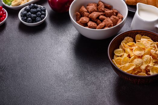 Delicious breakfast with fresh croissants and ripe berries on a beautiful wooden table