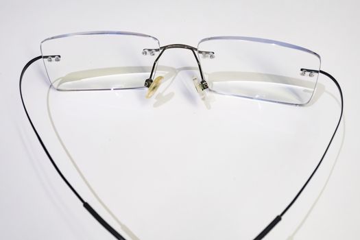 close up eyeglasses on white background