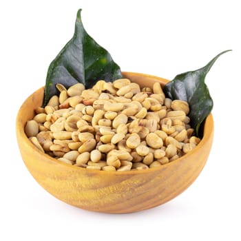 Coffee beans in a wooden bowl isolated on white background.