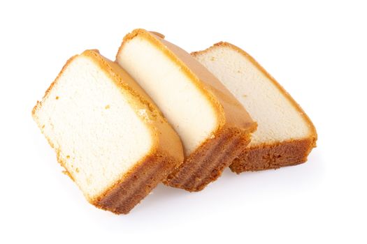 Sliced moist butter cake isolated over the white background.