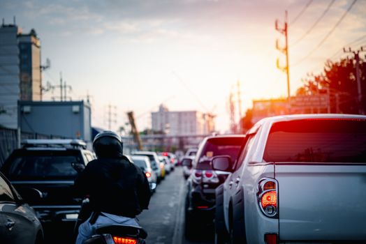 Cars on busy road in the Bangkok city, Thailand. Many cars use the street for transportation in rushhour with a traffic jam