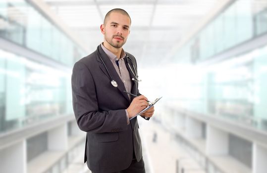 happy male doctor, at the hospital