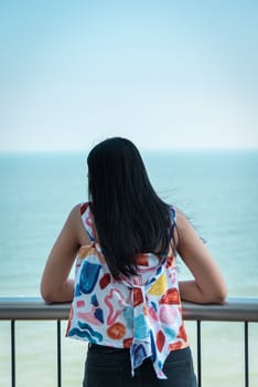 Asian pretty woman relax at sea viewpoint with happy and fun emotion in concept travel, vacation, leisure in life