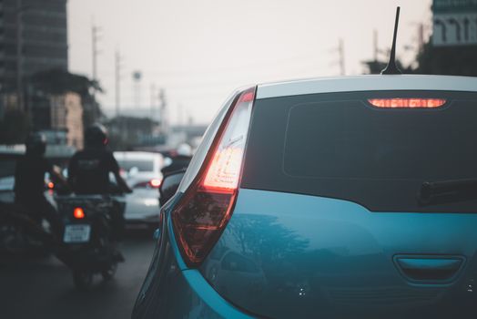 Cars on busy road in the Bangkok city, Thailand. Many cars use the street for transportation in rushhour with a traffic jam