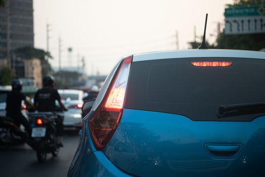 Cars on busy road in the Bangkok city, Thailand. Many cars use the street for transportation in rushhour with a traffic jam