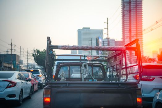 Cars on busy road in the Bangkok city, Thailand. Many cars use the street for transportation in rushhour with a traffic jam