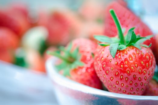 Strawberry is red fresh berry fruit color and sweet juicy for sale at Thai street food and fruit market in concept food and fruit, healthy eating in life